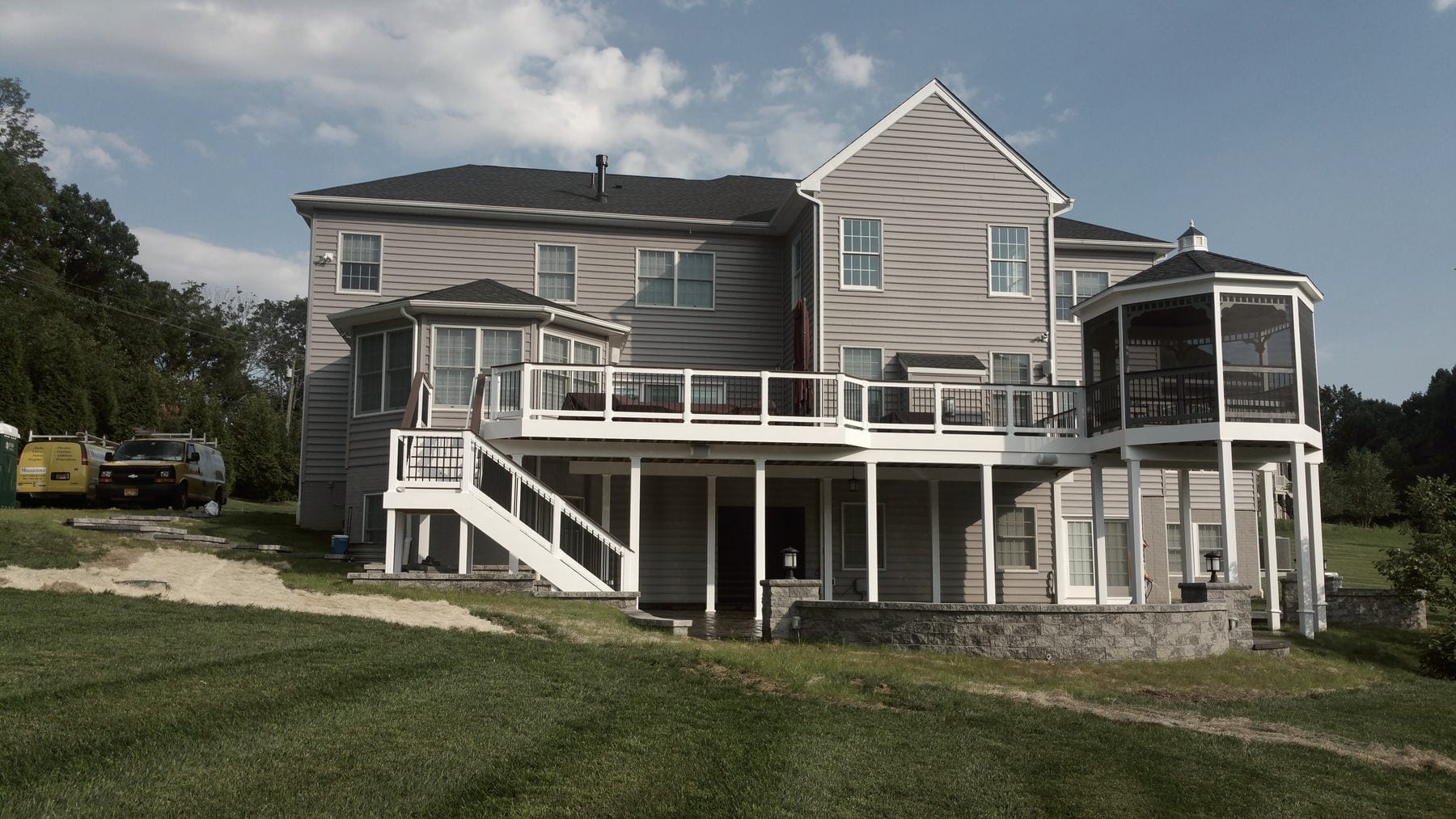 A large multi-level deck on a two-story house, built by Maryland Deck Builders